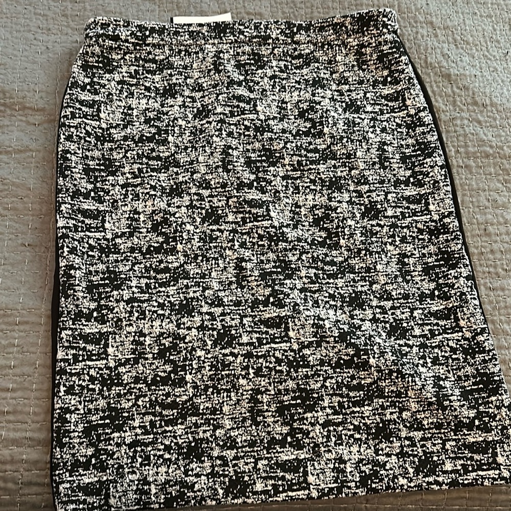 Brand new size 12 Black and White print skirt. Black print on the back.
